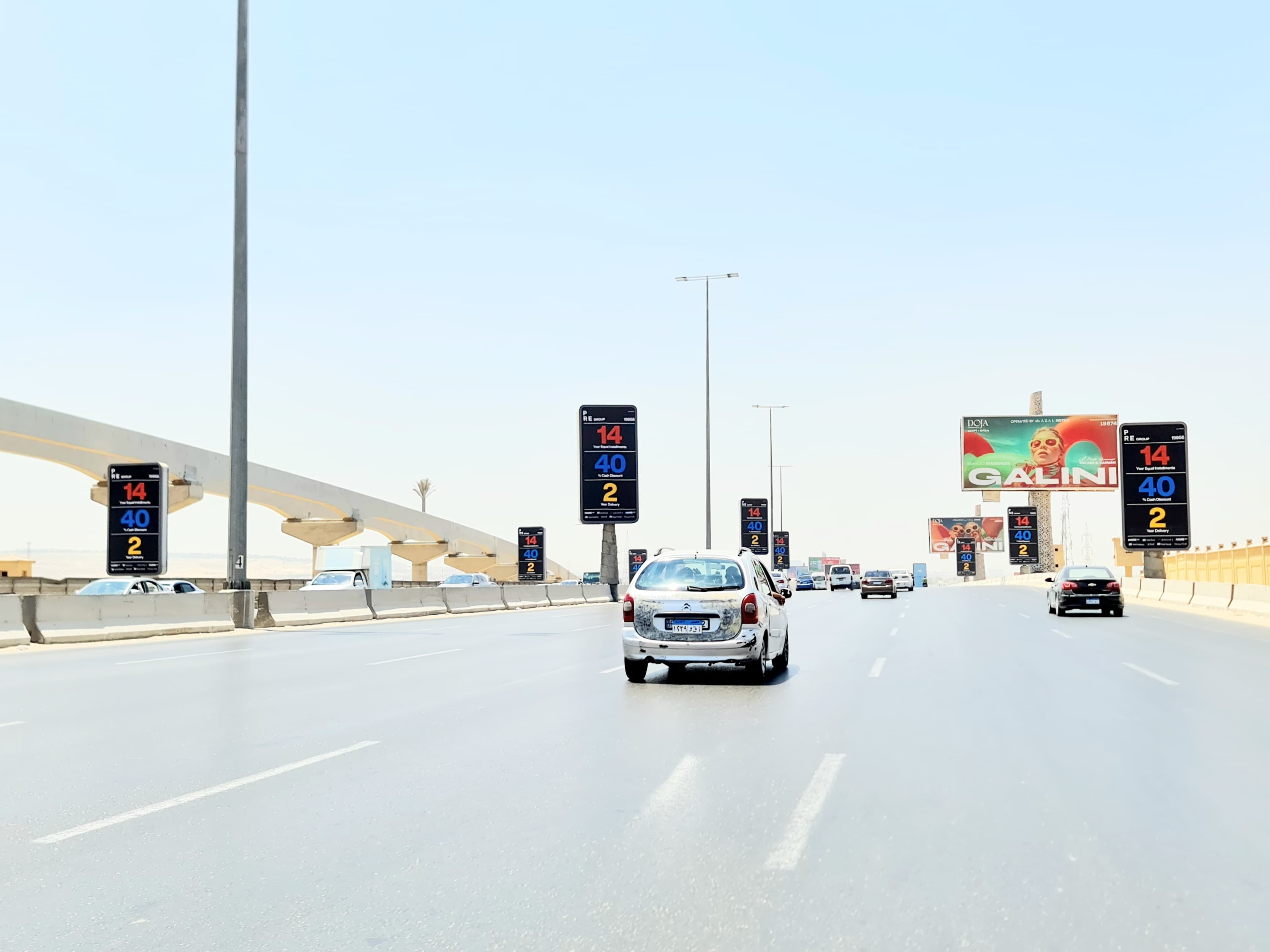 Mehwar exit flags (Cairo–Alex ramp) — photograph of the site; may show another face at this location